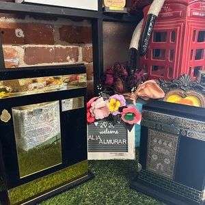 Both Qurans in decorative protective sleeves